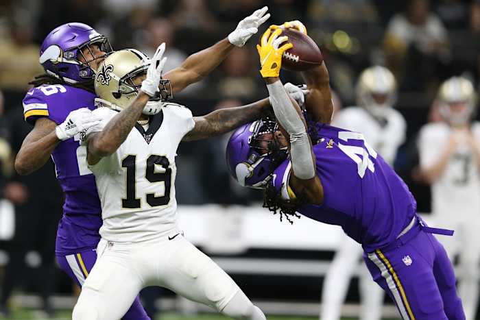 Jan 5, 2020; New Orleans, Louisiana, USA; Minnesota Vikings defensive back Anthony Harris (41) intercepts a pass interned for New Orleans Saints wide receiver Ted Ginn (19) as Minnesota cornerback Trae Waynes (26) backs up the play during the second quarter of a NFC Wild Card playoff football game at the Mercedes-Benz Superdome. Mandatory Credit: Chuck Cook -USA TODAY Sports